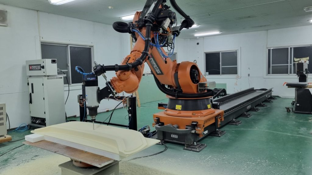 Robot machining with lineal track